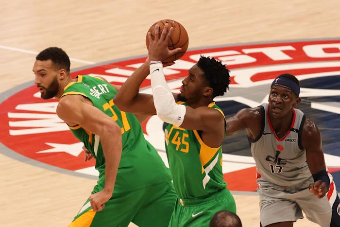 Donovan Mitchell (45) puts up a shot against the Washington Wizards